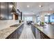 Modern kitchen with granite countertops, dark cabinets, and stainless steel appliances at 4145 S Zephyr --, Mesa, AZ 85212