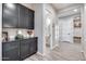 Inviting entryway with built-in storage and powder room at 4145 S Zephyr --, Mesa, AZ 85212