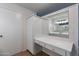 Bathroom with a vanity and large mirror at 4841 E Paiute St, Phoenix, AZ 85044