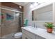 Bathroom with walk-in shower, vanity with quartz countertop at 6514 N 85Th Pl, Scottsdale, AZ 85250