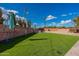 Artificial turf backyard with games and seating at 6514 N 85Th Pl, Scottsdale, AZ 85250