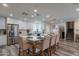 Modern kitchen with white cabinets, island, and stainless steel appliances at 6514 N 85Th Pl, Scottsdale, AZ 85250