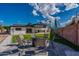 Landscaped backyard with fire pit and seating at 6514 N 85Th Pl, Scottsdale, AZ 85250
