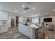 Modern kitchen with white cabinets, island, and stainless steel appliances at 6514 N 85Th Pl, Scottsdale, AZ 85250