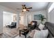 Open living area with comfortable seating, a coffee table, and access to other rooms at 6514 N 85Th Pl, Scottsdale, AZ 85250