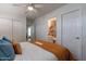 Comfortable bedroom with a king-size bed and ensuite bathroom access at 6514 N 85Th Pl, Scottsdale, AZ 85250