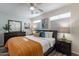 Main bedroom with a king-size bed, ceiling fan, and ample closet space at 6514 N 85Th Pl, Scottsdale, AZ 85250