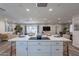 Modern kitchen with white cabinets, island, and stainless steel appliances at 6514 N 85Th Pl, Scottsdale, AZ 85250