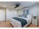 Main bedroom with king bed, walk-in closet, and mounted TV at 6514 N 85Th Pl, Scottsdale, AZ 85250