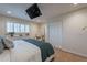 Main bedroom with a king-size bed, walk-in closet and a ceiling mounted TV at 6514 N 85Th Pl, Scottsdale, AZ 85250