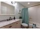 Clean bathroom with tub, shower, vanity, and granite countertop at 6514 N 85Th Pl, Scottsdale, AZ 85250