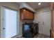 Laundry room with washer, dryer, and storage cabinets at 6514 N 85Th Pl, Scottsdale, AZ 85250