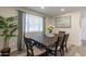 Bright dining room features a dark wood table with four chairs, and a large piece of art at 6514 N 85Th Pl, Scottsdale, AZ 85250