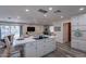 Modern kitchen with white cabinets, island, and stainless steel appliances at 6514 N 85Th Pl, Scottsdale, AZ 85250
