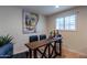 Small bar area with four black barstools at 6514 N 85Th Pl, Scottsdale, AZ 85250