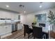 Bright eat-in kitchen with white cabinets, granite counters, and stainless steel appliances at 6514 N 85Th Pl, Scottsdale, AZ 85250