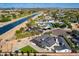 Aerial view of property near waterway and mountains at 6514 N 85Th Pl, Scottsdale, AZ 85250