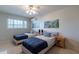 Spacious bedroom with twin beds, ceiling fan, and wood nightstand at 6514 N 85Th Pl, Scottsdale, AZ 85250