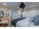 Main bedroom with king bed, en-suite bathroom, and walk-in closet at 6514 N 85Th Pl, Scottsdale, AZ 85250