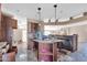 Kitchen with wood cabinets, granite counters, and island at 3718 S 379Th Ave, Tonopah, AZ 85354