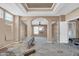 Spacious living room with high ceilings and built-in shelving needs renovation at 3718 S 379Th Ave, Tonopah, AZ 85354