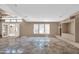 Empty living room features tiled floors and French doors at 3718 S 379Th Ave, Tonopah, AZ 85354