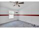 Simple bedroom with carpet, window, and ceiling fan at 3718 S 379Th Ave, Tonopah, AZ 85354