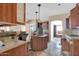 Kitchen boasts wood cabinets and granite countertops at 3718 S 379Th Ave, Tonopah, AZ 85354