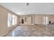 Empty living room with tiled floors and built-in shelving at 3718 S 379Th Ave, Tonopah, AZ 85354