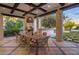 Outdoor dining area with stone fireplace and built-in bar at 5201 N Saddle Rock Dr, Phoenix, AZ 85018
