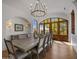 Formal dining room with hardwood floors and rustic wooden doors at 5201 N Saddle Rock Dr, Phoenix, AZ 85018