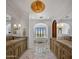 Luxurious bathroom with double vanities, marble flooring, and a soaking tub at 5201 N Saddle Rock Dr, Phoenix, AZ 85018