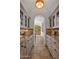 Butlers pantry with granite countertops and glass-front cabinets at 5201 N Saddle Rock Dr, Phoenix, AZ 85018