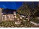 Evening view of the backyard patio and fire pit at 5201 N Saddle Rock Dr, Phoenix, AZ 85018