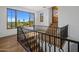 Open-concept hallway with wood flooring, iron railing, and views at 5201 N Saddle Rock Dr, Phoenix, AZ 85018