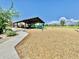 Modern playground structure with slides and climbing features under a covered area at 18147 W Ida Ln, Surprise, AZ 85387