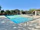 Community pool with a covered patio and BBQ grills at 18147 W Ida Ln, Surprise, AZ 85387