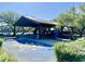 Playground with covered structure, slides, and benches at 18147 W Ida Ln, Surprise, AZ 85387