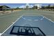 Full-size outdoor basketball court with green and blue coloring at 18147 W Ida Ln, Surprise, AZ 85387