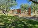 playground with climbing structures, slides, and benches at 18147 W Ida Ln, Surprise, AZ 85387