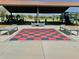 Park with shaded seating area and large red and black checkered game board at 18147 W Ida Ln, Surprise, AZ 85387