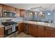 Modern kitchen features stainless steel appliances and granite countertops at 2801 E Osborn Rd, Phoenix, AZ 85016