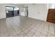 Living room with tile floors and sliding glass doors leading to patio at 2970 N Oregon St # 10, Chandler, AZ 85225