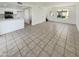 Open living room with tile flooring and kitchen access at 2970 N Oregon St # 10, Chandler, AZ 85225