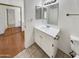 Bathroom with vanity, toilet and mirrored closet at 2970 N Oregon St # 10, Chandler, AZ 85225