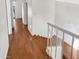 Hardwood floors in a bright hallway with access to bedrooms at 2970 N Oregon St # 10, Chandler, AZ 85225