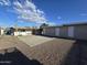 Large backyard with covered patio and storage shed at 206 N 5Th St, Avondale, AZ 85323