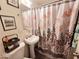 Clean bathroom with pedestal sink and shower/tub at 206 N 5Th St, Avondale, AZ 85323