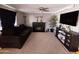 Living room with fireplace and large TV at 206 N 5Th St, Avondale, AZ 85323