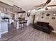 Open living room with dark gray couch and kitchen views at 206 N 5Th St, Avondale, AZ 85323
